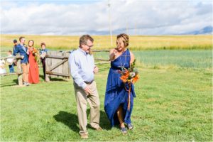 bride and groom taking portraits in mountain montana