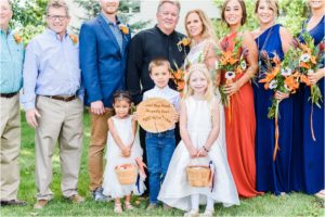 bride and groom take family portraits in mountain montana