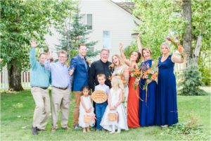 bride and groom take family portraits in mountain montana