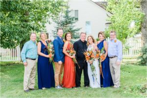 bride and groom take family portraits in mountain montana