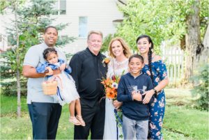 bride and groom take family portraits in mountain montana